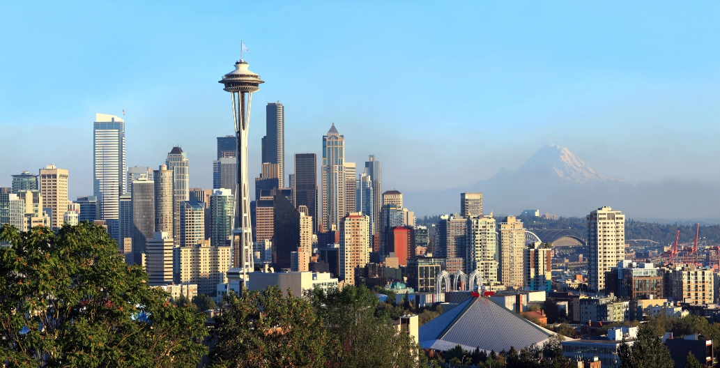 A panoramic view of Seattle Washington modern skyline buildings & mt. Rainier.