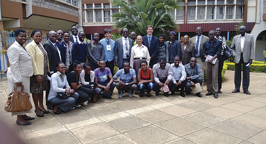 Kenyatta University School of Environmental Studies faculty pose with visiting Esri staff members Joseph Kerski and Michael Gould.
